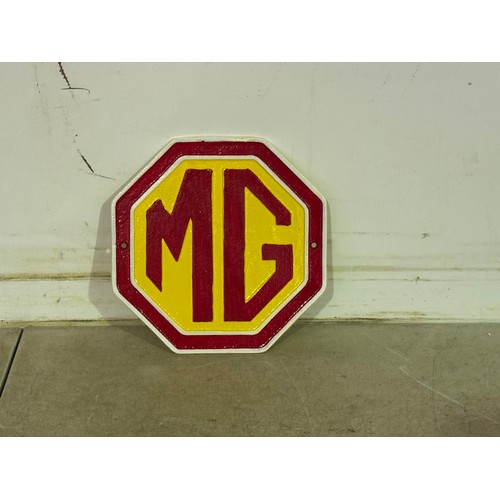 5190 - An octagonal cast metal MG car badge wall plaque* This lot is subject to VAT