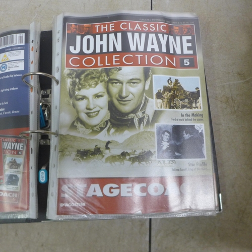 5100 - A large quantity of John Wayne DVDs and 3 folders of John Wayne magazines 1-70