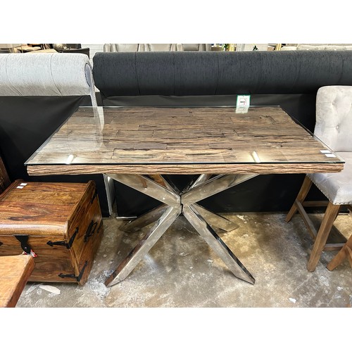 3229 - A Chennai bar table with an X base  *This lot is subject to Vat