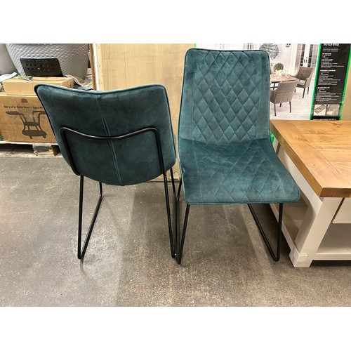 3250 - A pair of emerald green dining chairs  *This lot is subject to Vat