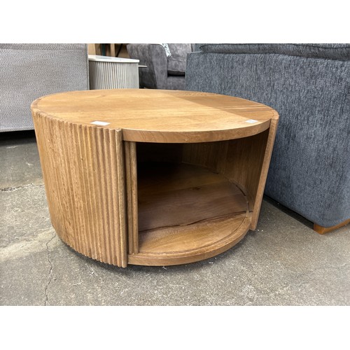 3208 - A mango wood coffee table with sliding door  *This lot is subject to Vat