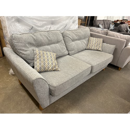 3210 - A grey fabric upholstered button back three seater sofa