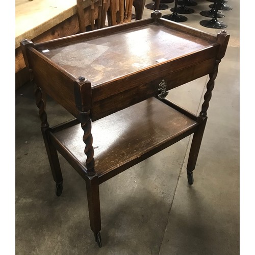 299 - An early 20th Century oak barleytwist trolley