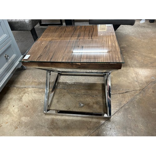 3194 - A hardwood side table with chrome base and glass top  *This lot is subject to Vat