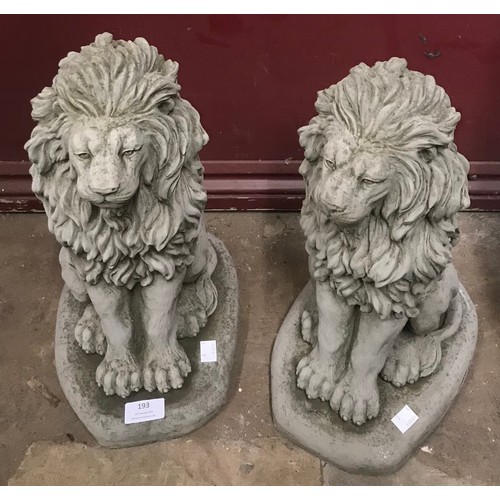 314 - A pair of concrete garden figures of seated lions