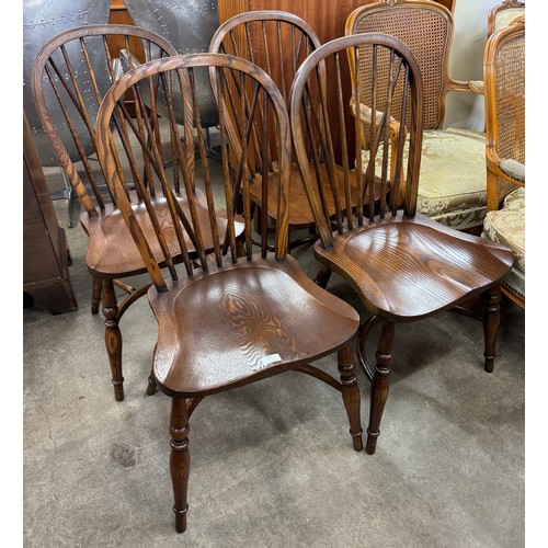 201 - A set of four elm Windsor dining chairs