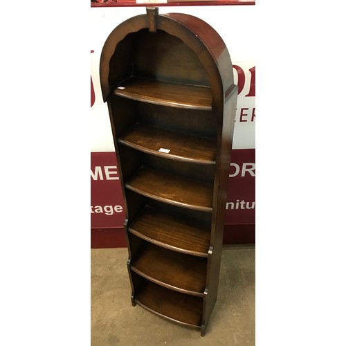 229 - An oak waterfall front open bookcase