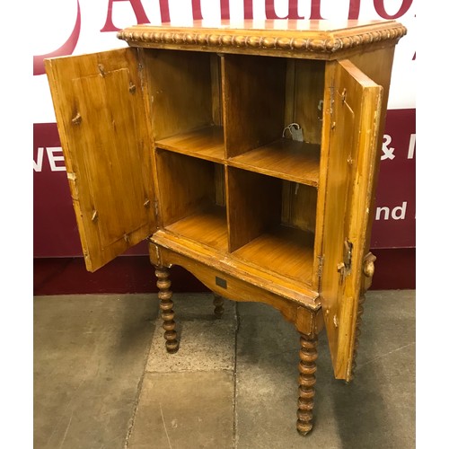 235 - A Victorian scrumbled pine two door cupboard