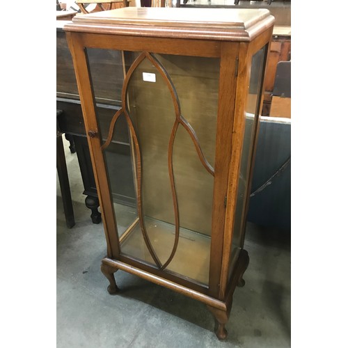 236 - An early 20th Century oak single door display cabinet