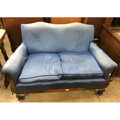 254 - An Edward VII mahogany and blue fabric upholstered settee