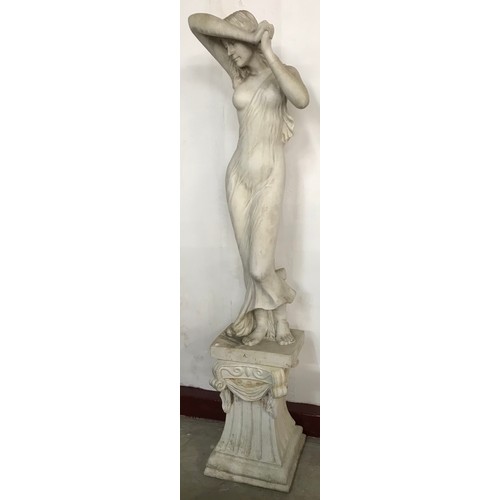 306 - A large Romanesque style faux marble figure of a lady, on stand