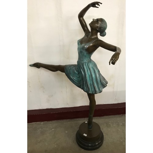 307 - A large bronze figure of a ballerina on black marble socle