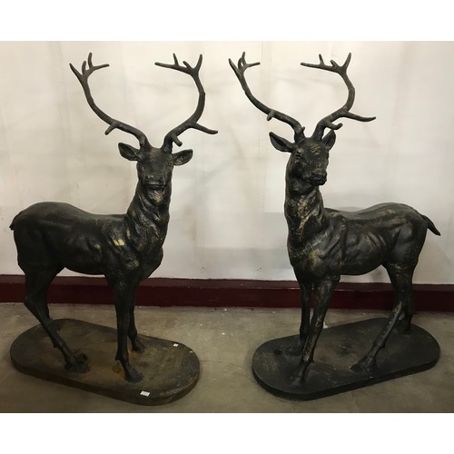 311 - A pair of large cast iron figures of stags