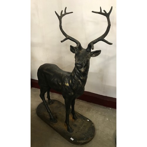 311 - A pair of large cast iron figures of stags