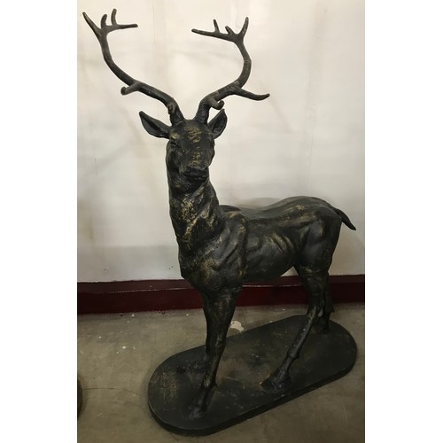 311 - A pair of large cast iron figures of stags