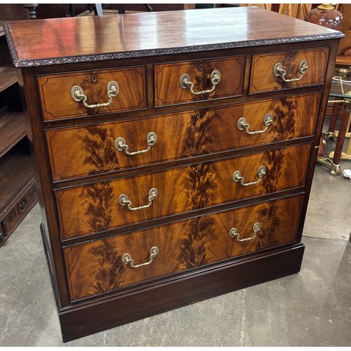 165 - An Edward VII flame figured mahogany chest of drawers