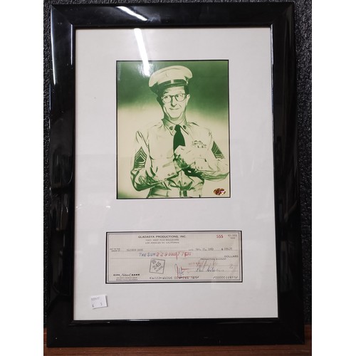 402 - A signed Phil Silvers display with cheque, and four assorted prints