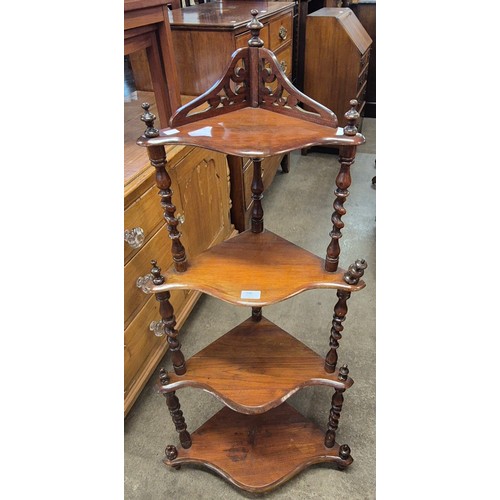 200 - A Victorian walnut four tier corner whatnot