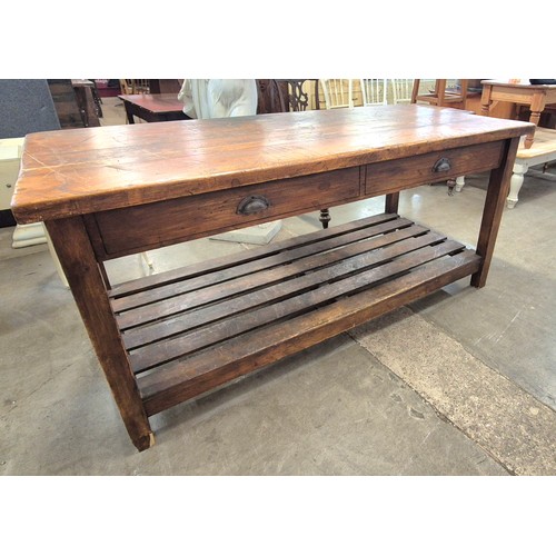 298A - A large Victorian style stained pine work table