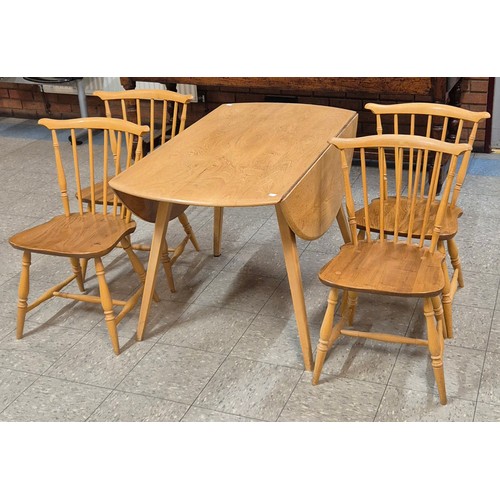 28A - An Ercol Blonde elm and beech Windsor drop leaf table and four chairs