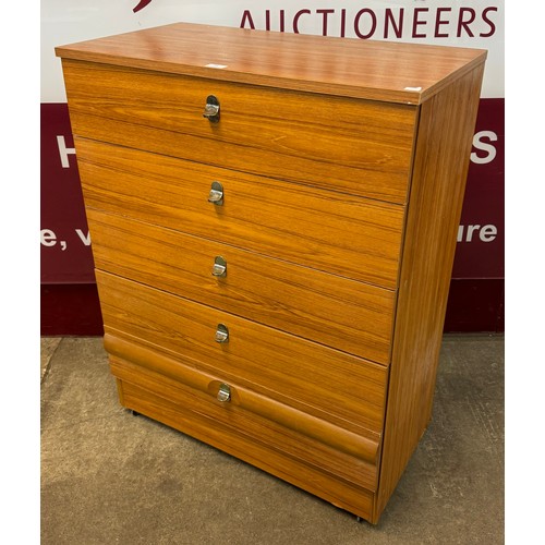 51 - A simulated teak chest of drawers