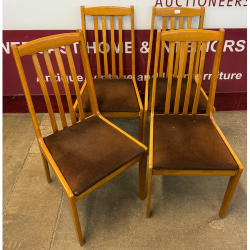 58 - A set of four teak dining chairs