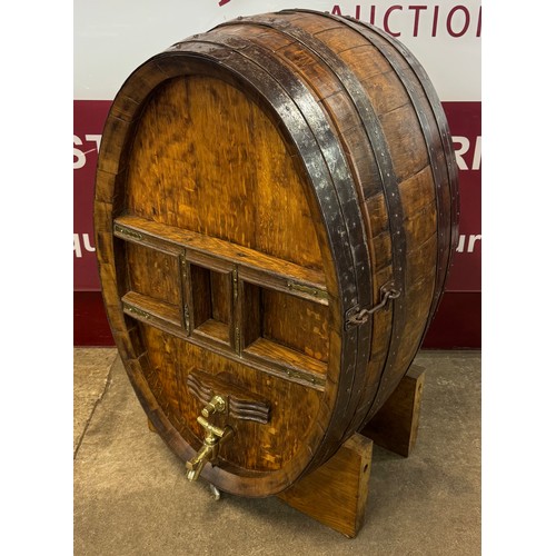 93 - An early 20th Century coopered oak barrel shaped bar