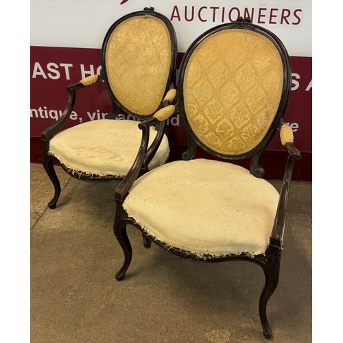 96 - A pair of 19th Century French Louis XV style carved mahogany fauteuil chairs