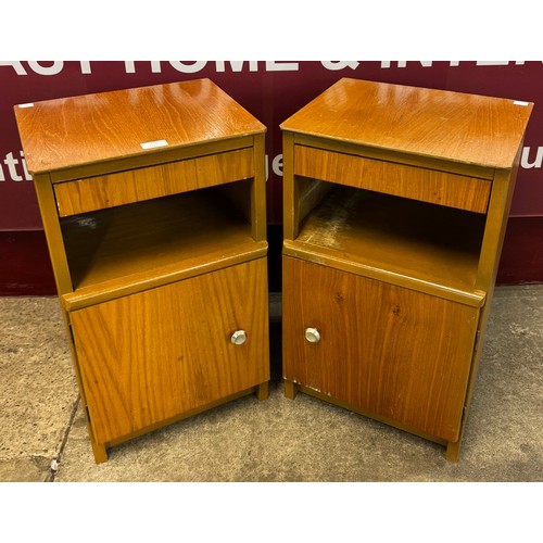 47 - A pair of teak bedside cupboards