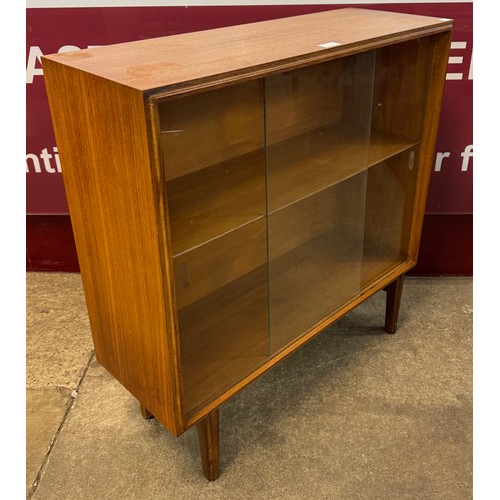 50 - A teak two door bookcase