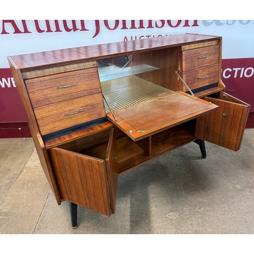 63 - A Beautility tola wood sideboard