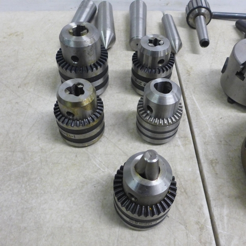 5013 - A quantity of assorted three jaw lathe chucks and keys