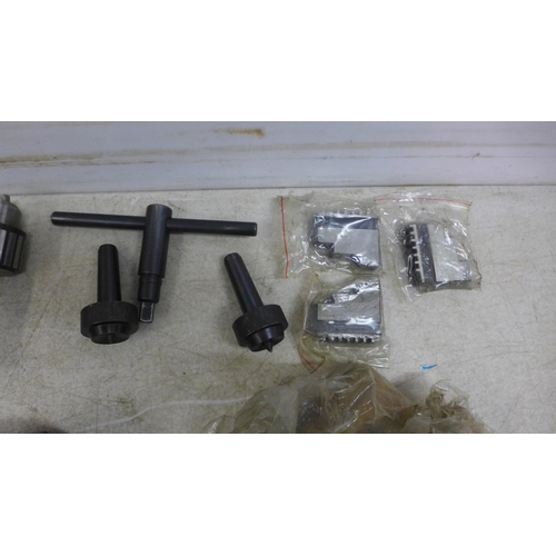 5013 - A quantity of assorted three jaw lathe chucks and keys