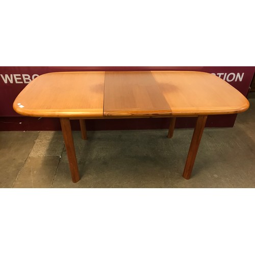 66 - A Danish teak extending dining table and four chairs