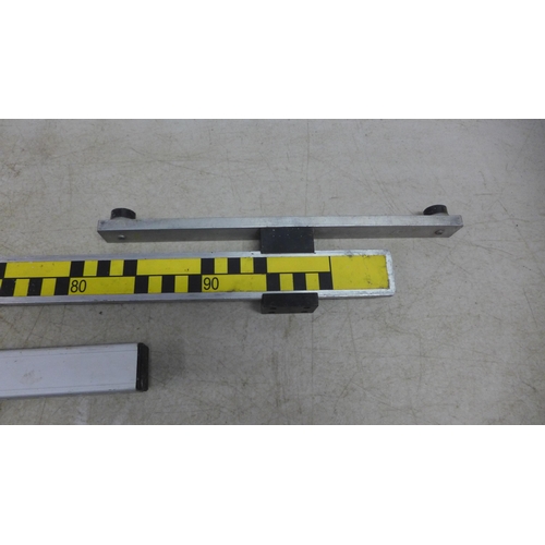 5033 - A 1 meter Hudsons Datum defect gauge and a clamp