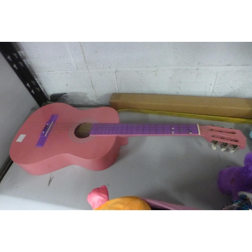 5103 - A pink guitar and a quantity of soft toys