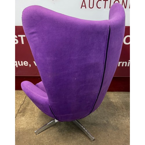 78 - A chrome and purple fabric revolving lounge chair