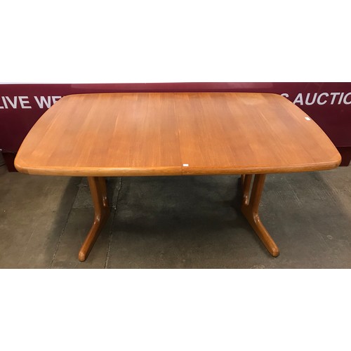 80 - A Danish teak extending dining table