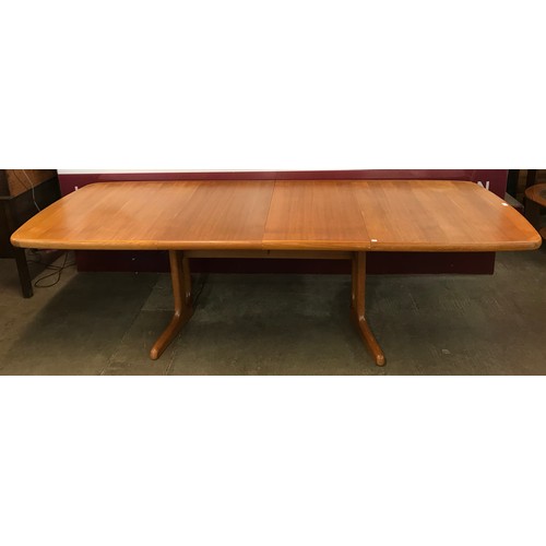 80 - A Danish teak extending dining table