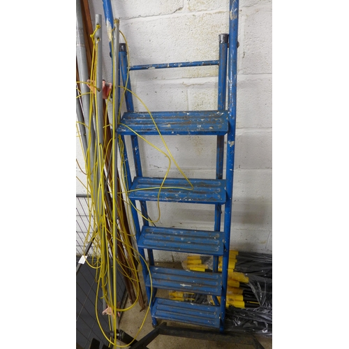 A Black and Decker Workmate 300 folding workbench with a set of blue ...