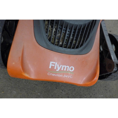 A Flymo Chevron 34VC, 240V electric lawn mower, with collection box