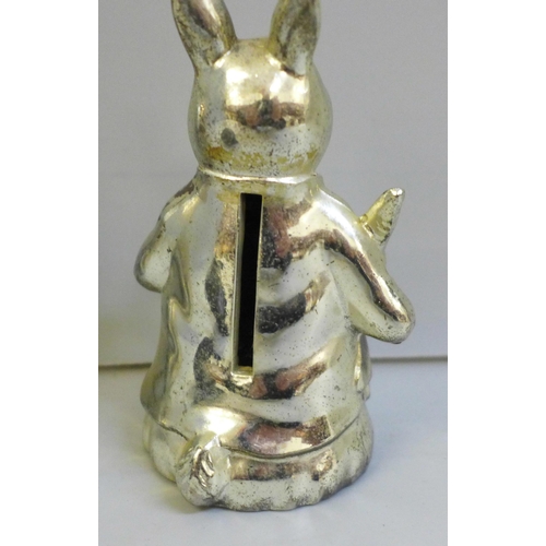 2040 - A French ice cream mould, a small hip flask and a novelty plated money box in the form of a rabbit