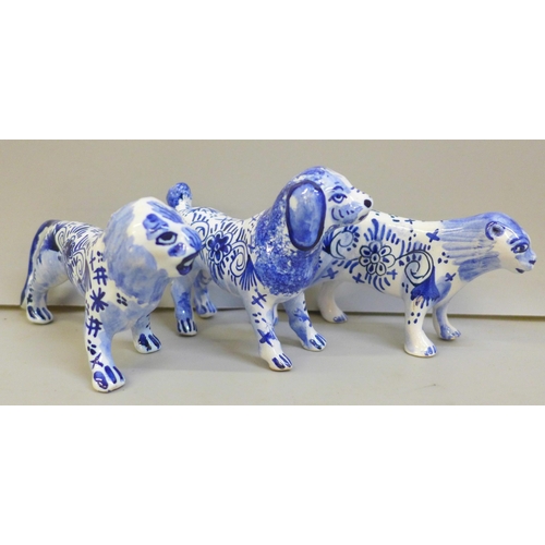 2043 - Three Delft blue and white pottery figures, lion, lioness and a dog, lion 13cm