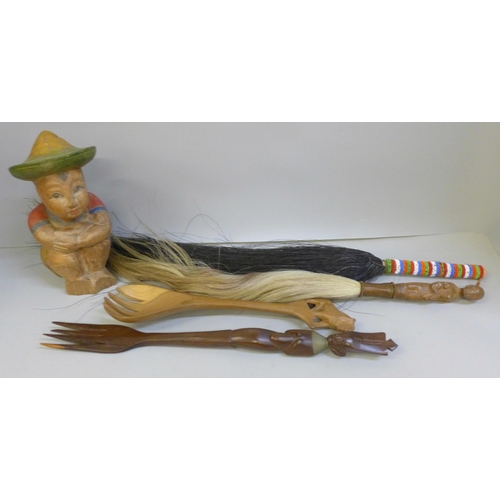 2059 - Two African fly swats, two carved wooden servers and a carved figure, (figure a/f)