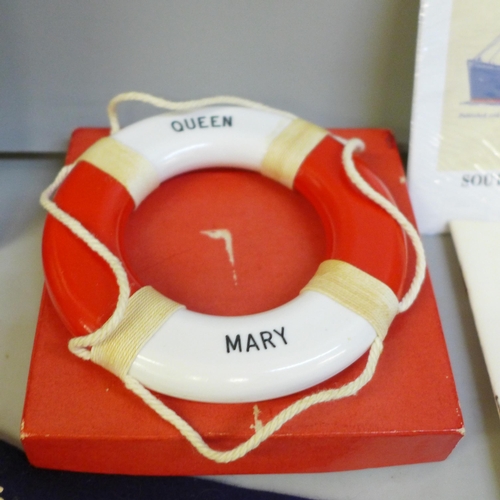 2063 - A collection of Queen Mary related ephemera, etc., including book, photographs, pennant, lifebuoy