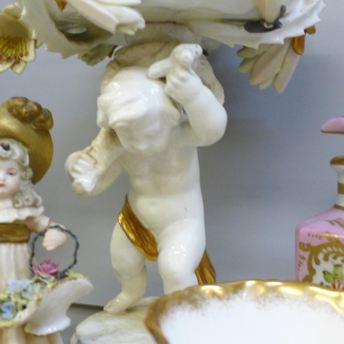 2089 - A collection of porcelain figures and china cups, saucers, trinket trays, scent bottle and a cherub ... 