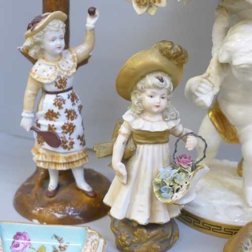 2089 - A collection of porcelain figures and china cups, saucers, trinket trays, scent bottle and a cherub ... 