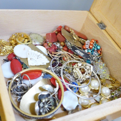 2092 - A large collection of costume jewellery in a wooden sewing box