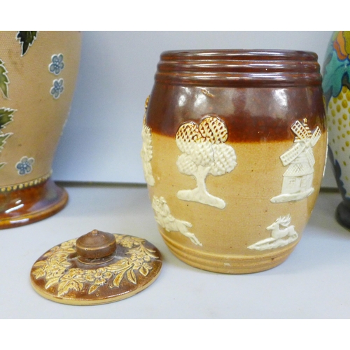 2094 - A Gouda vase, a Doulton vase, chip to the rim, and a Doulton tobacco jar, lid a/f