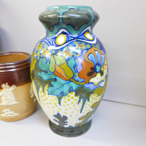 2094 - A Gouda vase, a Doulton vase, chip to the rim, and a Doulton tobacco jar, lid a/f